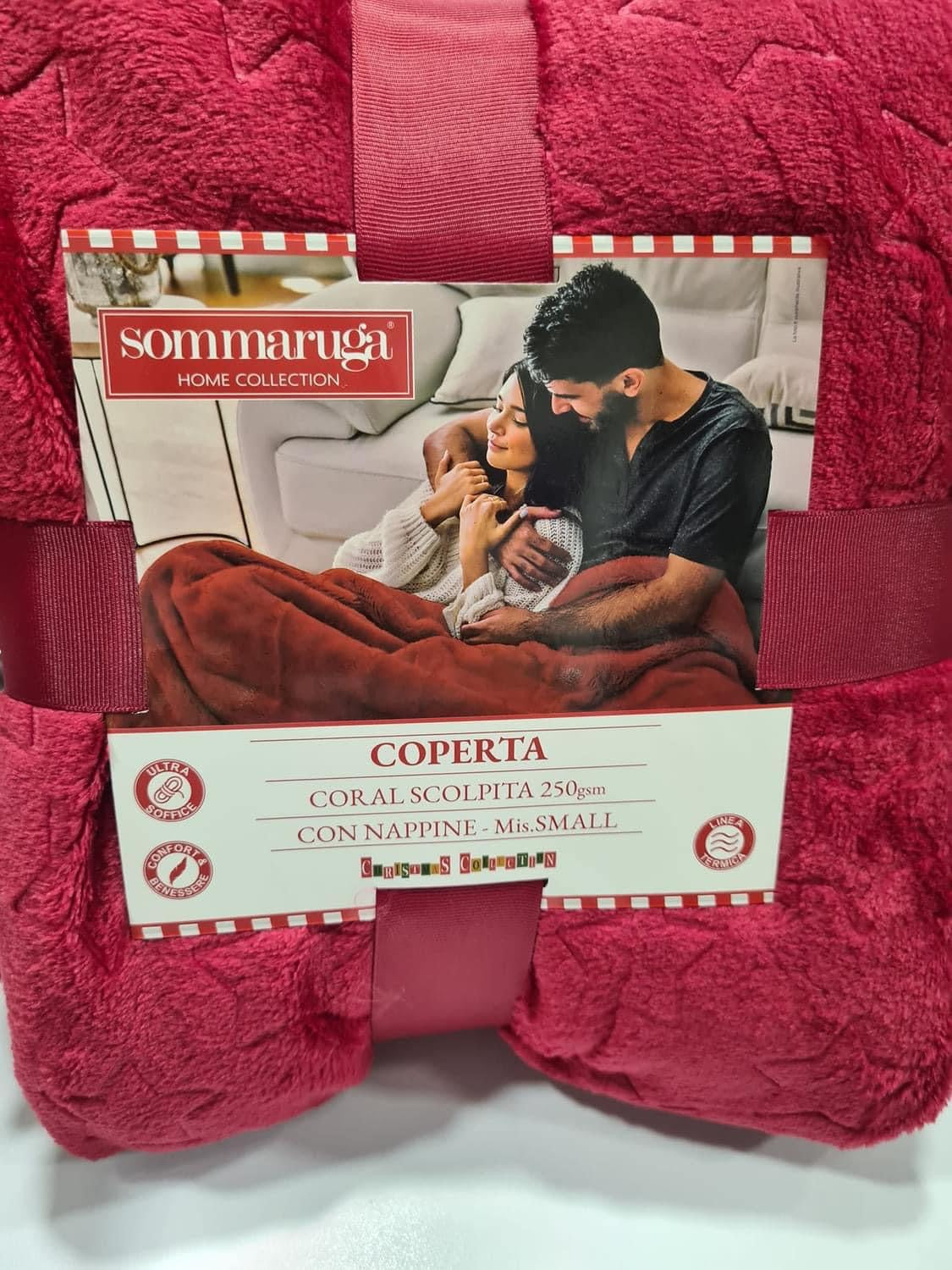 SOMMARUGA coperta in coral scolpita con nappine