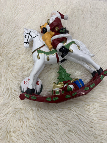 Babbo Natale su cavallo a dondolo
